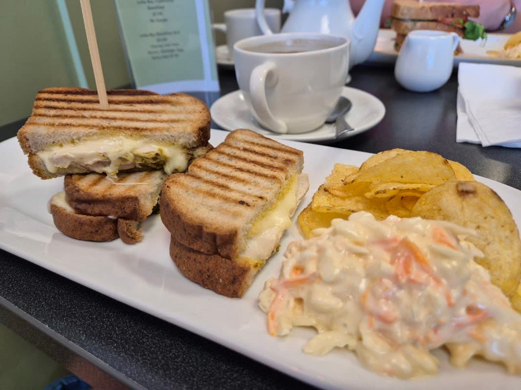A toasted sandwich, coleslaw and coffee at Little Bay Eatery, Queens Parade