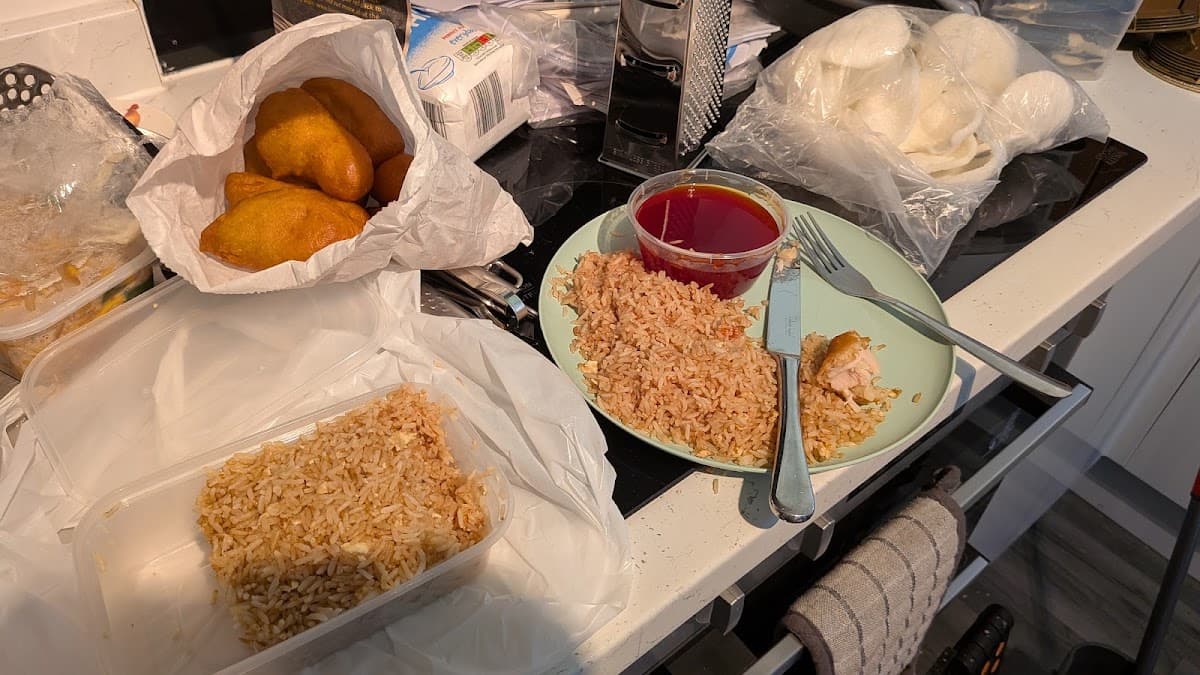 A Singapore Island takeaway order of egg fried rice, prawn crackers and sweet and sour