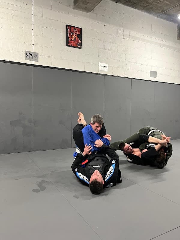Two members sparring on the mats at Gorilla Grapplers jiu-jitsu club, Waterlooville
