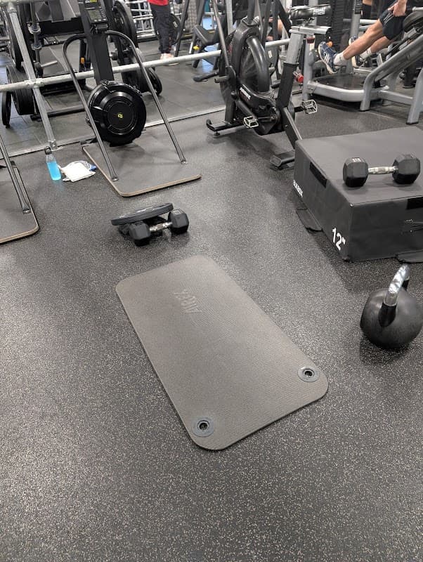 Dumbbells and benches in the weights area at PureGym Waterlooville