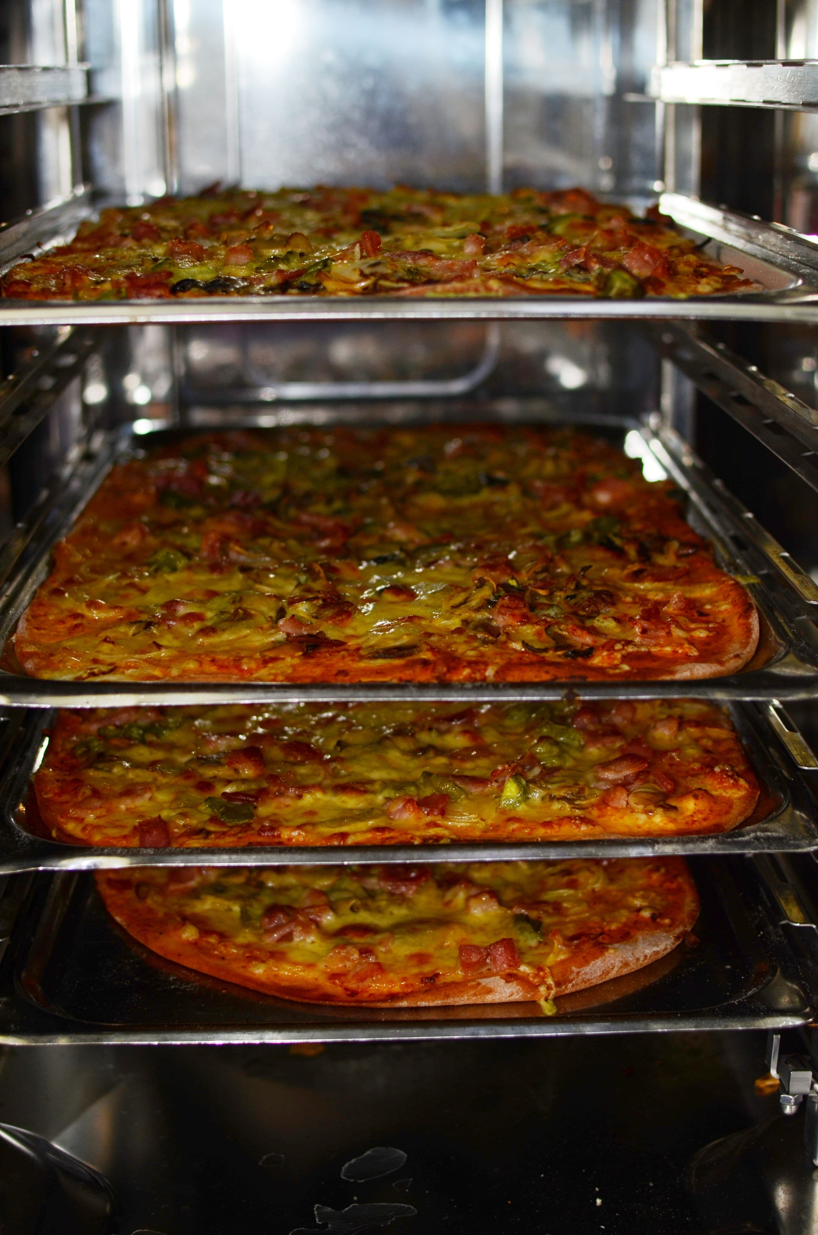 A pizza fresh from the oven, representative image