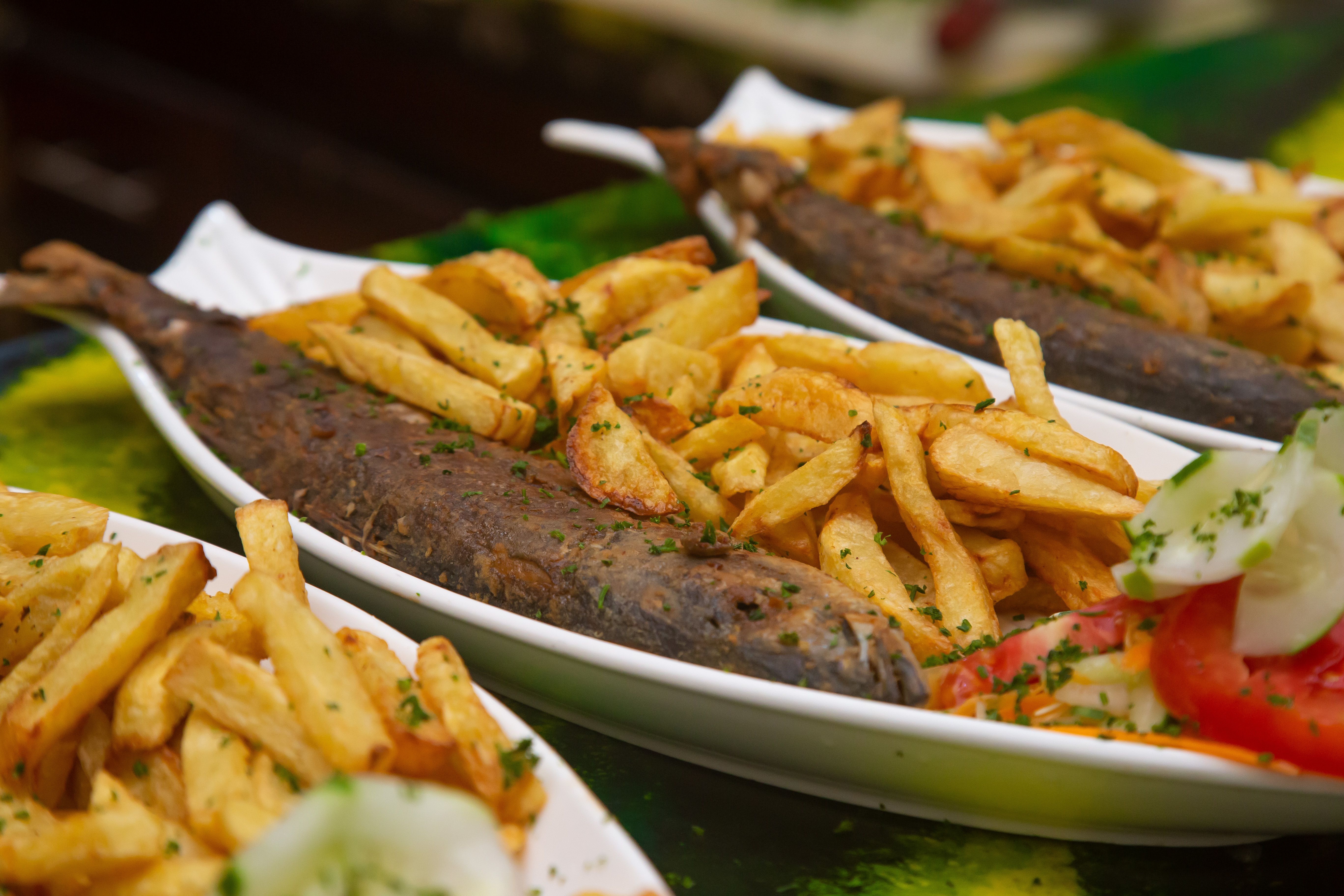 Fish and chips on a plate, representative image